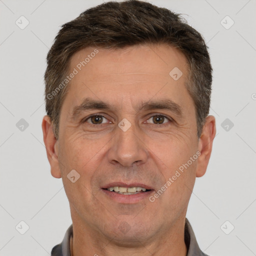 Joyful white adult male with short  brown hair and brown eyes