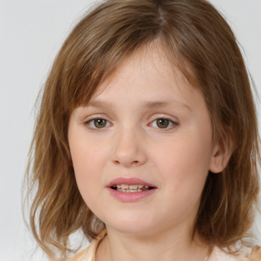 Joyful white child female with medium  brown hair and brown eyes