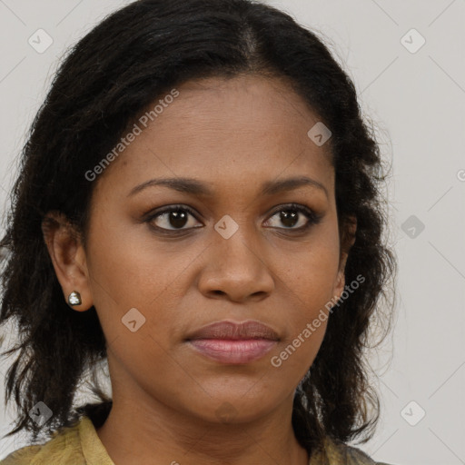 Joyful black young-adult female with long  brown hair and brown eyes