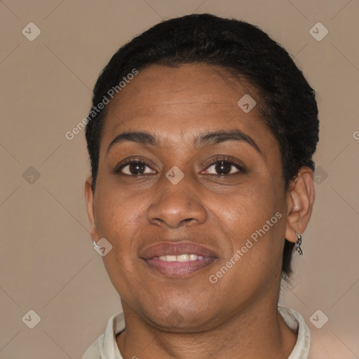 Joyful black adult female with short  brown hair and brown eyes