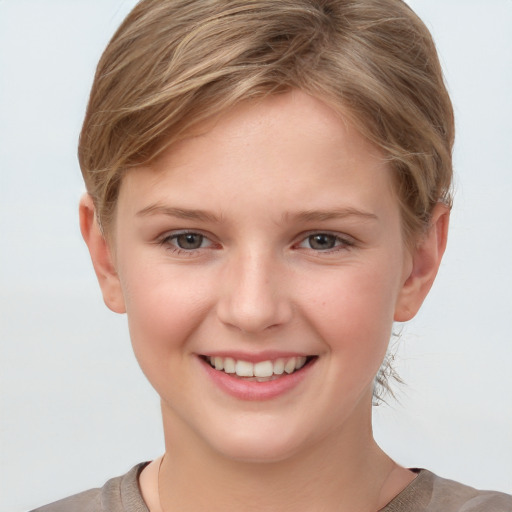 Joyful white child female with short  brown hair and grey eyes