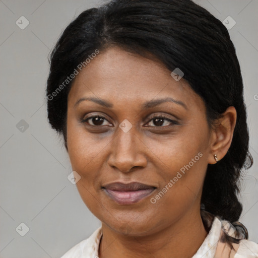 Joyful black adult female with medium  brown hair and brown eyes