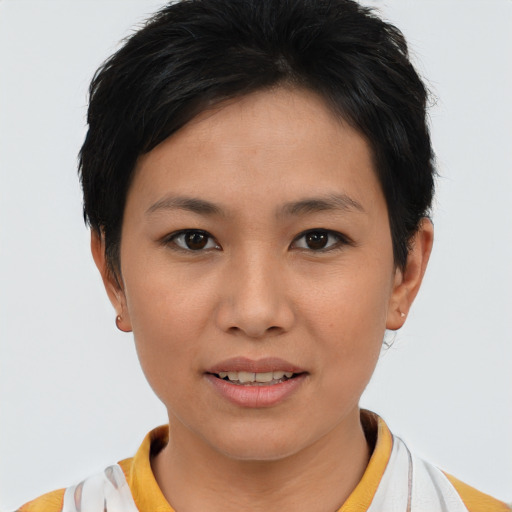 Joyful asian young-adult female with short  brown hair and brown eyes