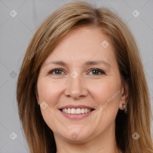 Joyful white adult female with long  brown hair and brown eyes