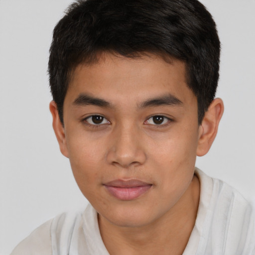Joyful latino young-adult male with short  brown hair and brown eyes