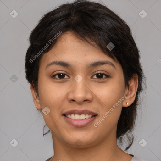 Joyful latino young-adult female with medium  brown hair and brown eyes