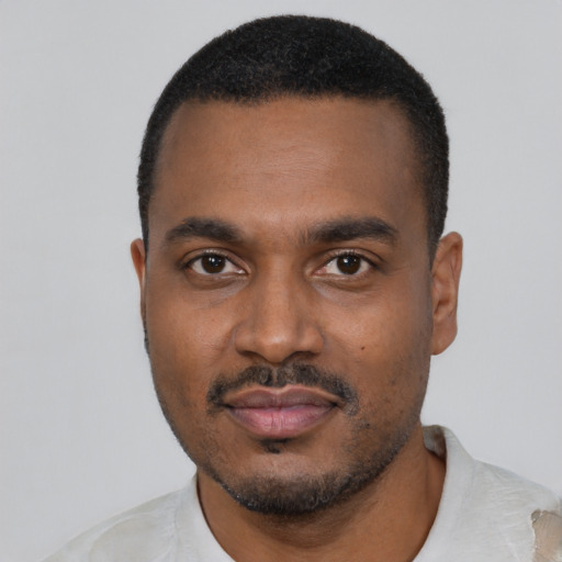 Neutral black young-adult male with short  black hair and brown eyes
