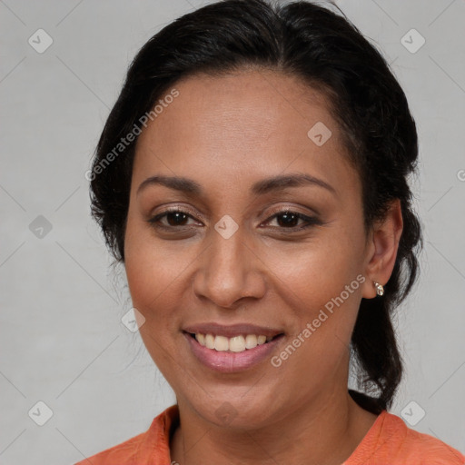 Joyful latino adult female with medium  brown hair and brown eyes