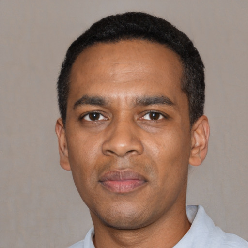 Neutral black young-adult male with short  black hair and brown eyes