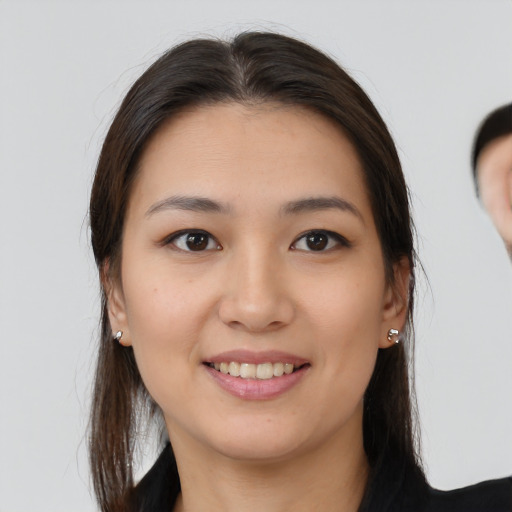Joyful white young-adult female with medium  brown hair and brown eyes