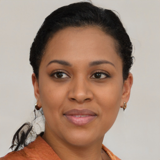 Joyful black young-adult female with short  brown hair and brown eyes