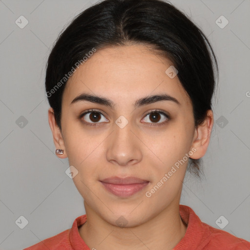 Joyful latino young-adult female with medium  brown hair and brown eyes