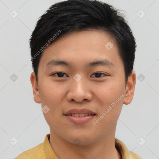 Joyful asian young-adult male with short  brown hair and brown eyes