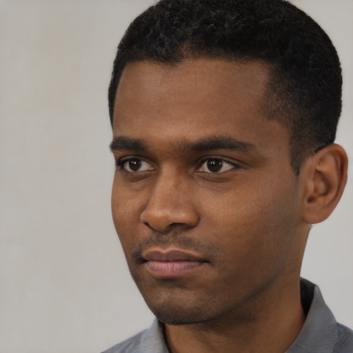Neutral black young-adult male with short  black hair and brown eyes