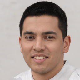 Joyful white young-adult male with short  black hair and brown eyes