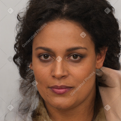 Joyful black young-adult female with long  brown hair and brown eyes