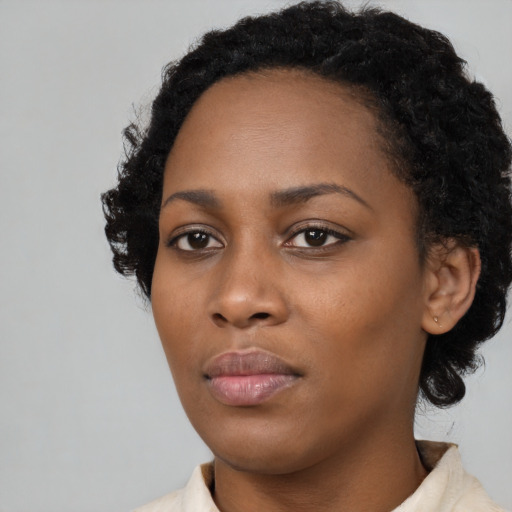 Neutral black young-adult female with medium  black hair and brown eyes