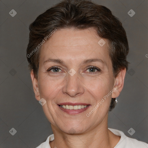 Joyful white adult female with short  brown hair and brown eyes