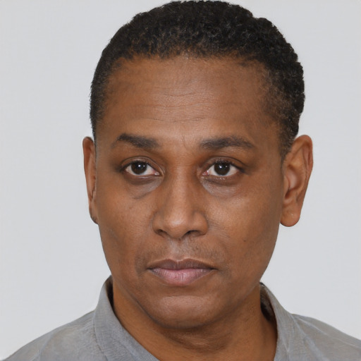 Neutral black adult male with short  black hair and brown eyes