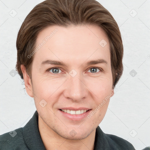 Joyful white adult male with short  brown hair and grey eyes