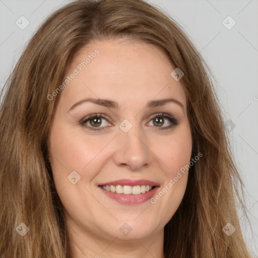 Joyful white young-adult female with long  brown hair and green eyes