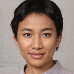 Joyful asian young-adult female with short  black hair and brown eyes