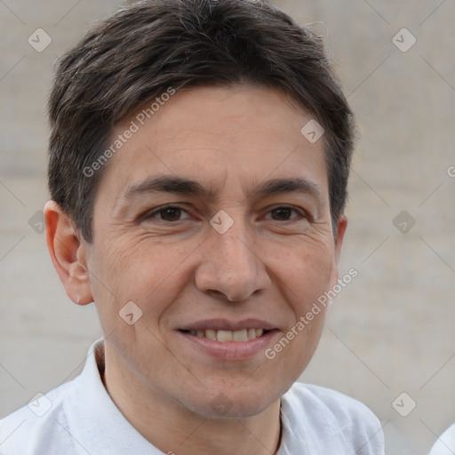 Joyful white adult male with short  brown hair and brown eyes