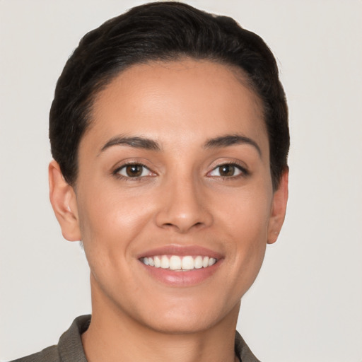 Joyful white young-adult female with short  brown hair and brown eyes