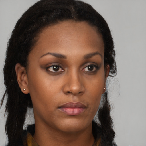 Neutral black young-adult female with long  brown hair and brown eyes