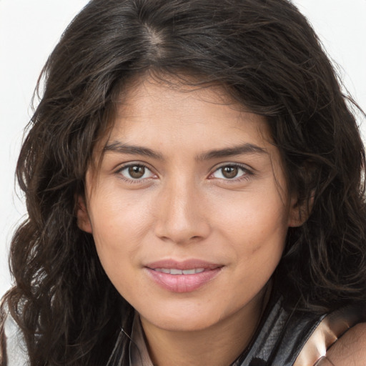 Joyful white young-adult female with long  brown hair and brown eyes