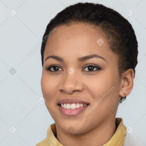 Joyful latino young-adult female with short  brown hair and brown eyes