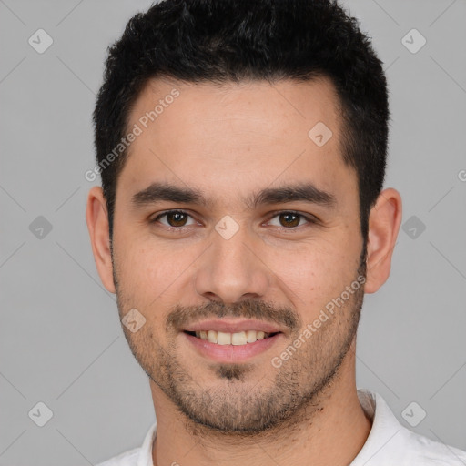 Joyful white young-adult male with short  black hair and brown eyes