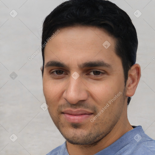 Joyful white young-adult male with short  black hair and brown eyes