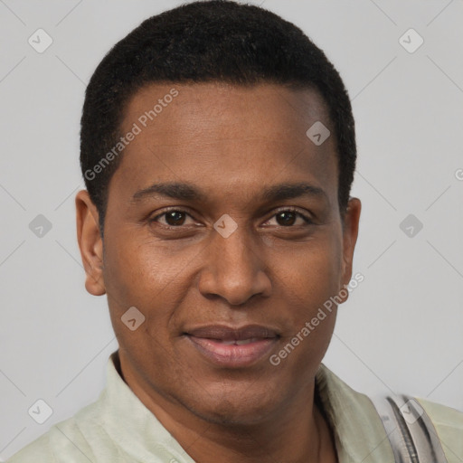 Joyful black young-adult male with short  brown hair and brown eyes