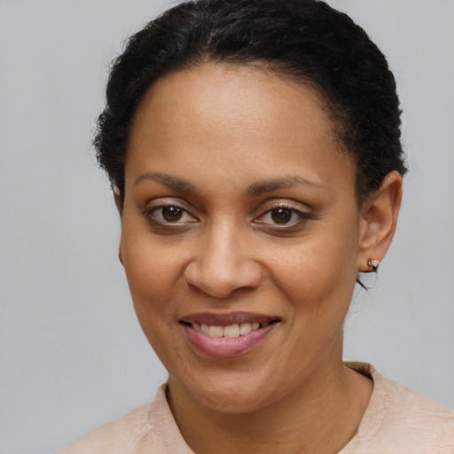 Joyful latino young-adult female with short  brown hair and brown eyes