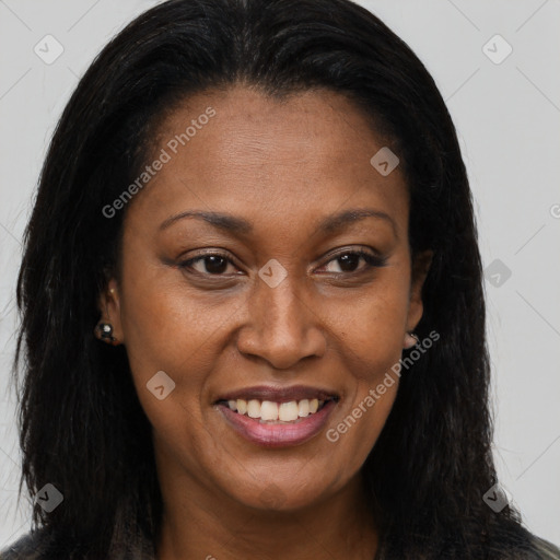 Joyful black young-adult female with long  brown hair and brown eyes