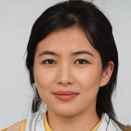 Joyful asian young-adult female with medium  black hair and brown eyes