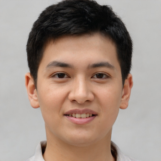 Joyful latino young-adult male with short  brown hair and brown eyes