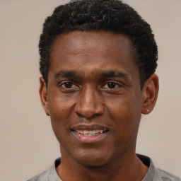 Joyful black adult male with short  black hair and brown eyes