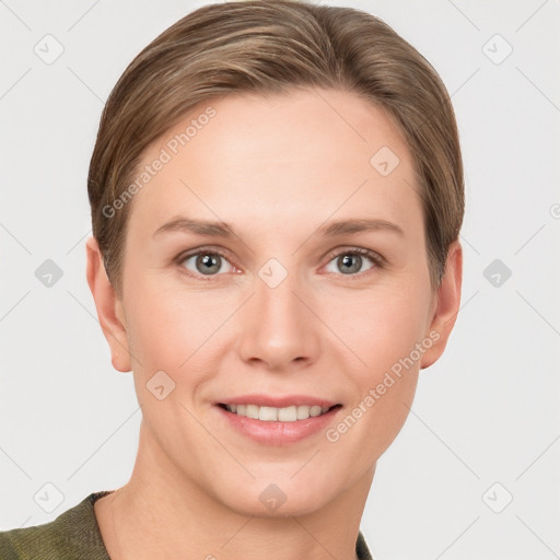 Joyful white young-adult female with short  brown hair and grey eyes