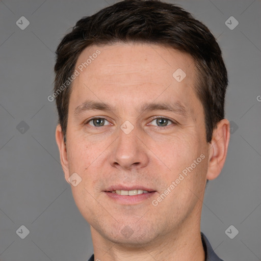 Joyful white adult male with short  brown hair and brown eyes