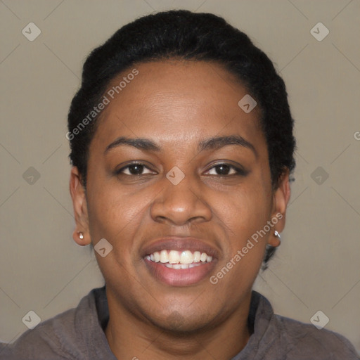 Joyful black young-adult female with short  black hair and brown eyes