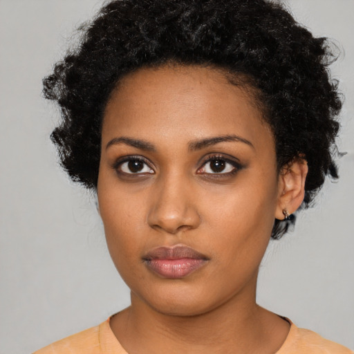 Neutral black young-adult female with short  black hair and brown eyes