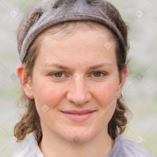 Joyful white young-adult female with medium  brown hair and blue eyes