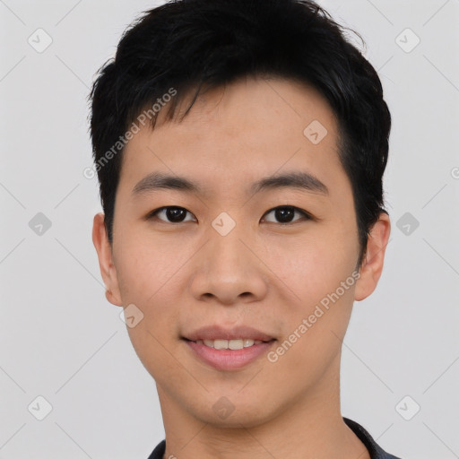 Joyful asian young-adult male with short  black hair and brown eyes