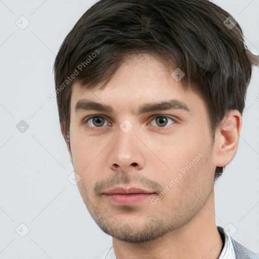 Neutral white young-adult male with short  brown hair and brown eyes