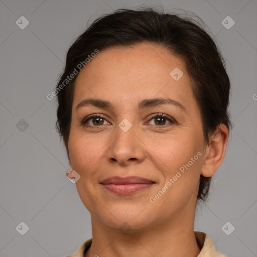 Joyful white adult female with medium  brown hair and brown eyes