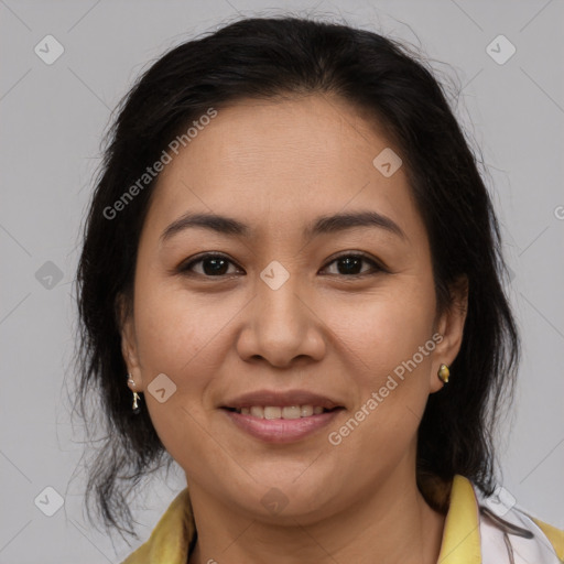 Joyful latino young-adult female with medium  brown hair and brown eyes