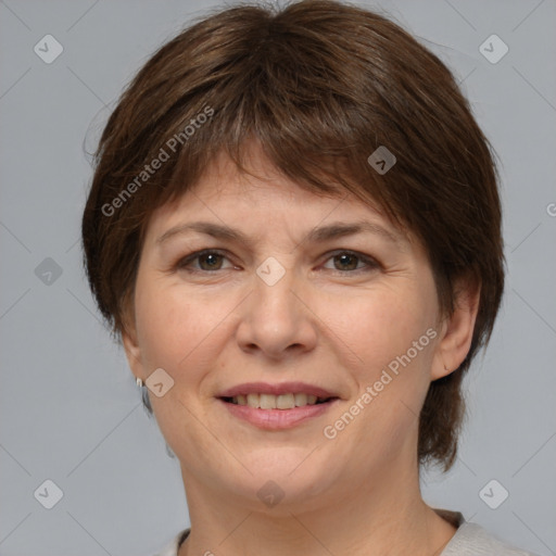 Joyful white adult female with medium  brown hair and brown eyes