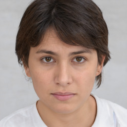 Neutral white young-adult female with medium  brown hair and brown eyes